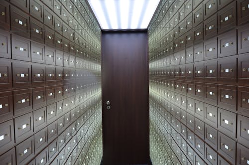 Free A hallway with a door and a row of mailboxes Stock Photo